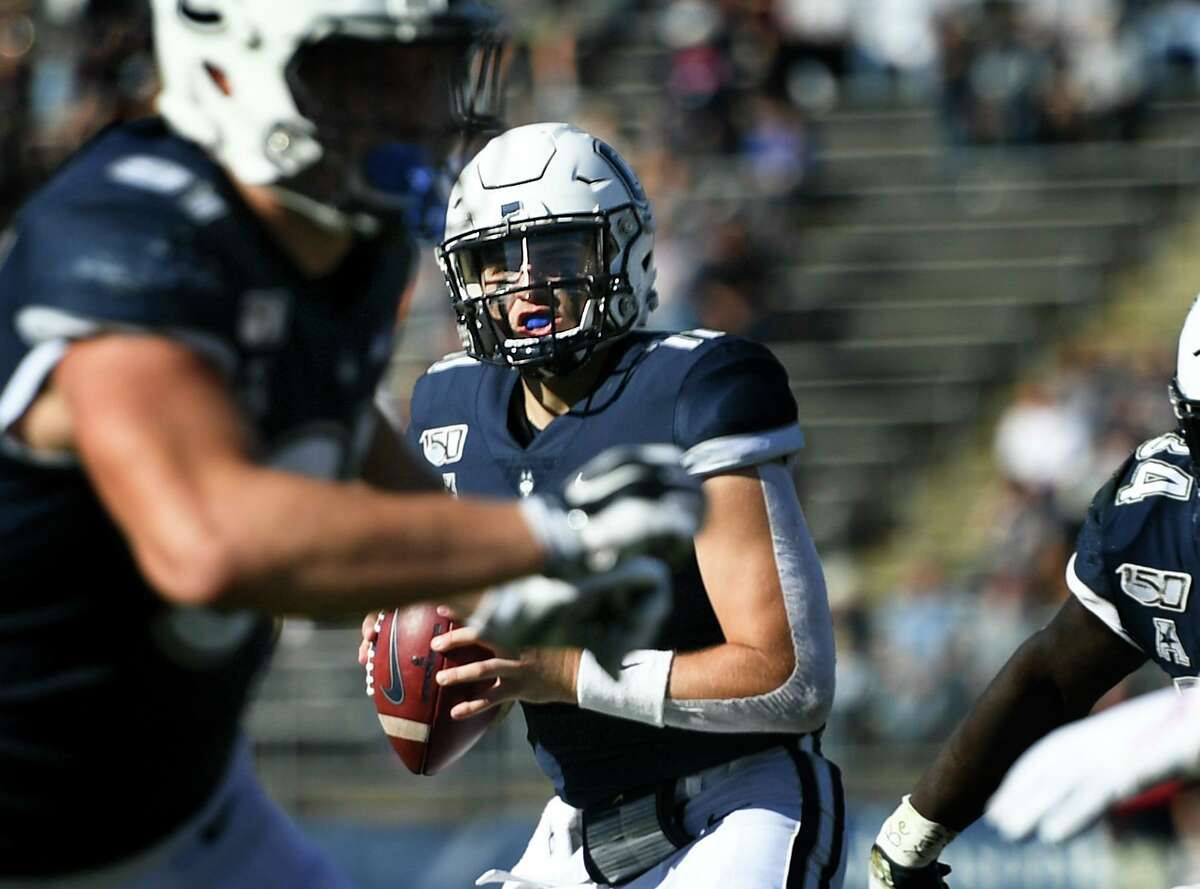 UConn quarterback Jack Zergiotis (11) sets to pass during the second half of an NCAA college football game against Houston on Saturday, Oct. 19, 2019, in East Hartford, Conn.