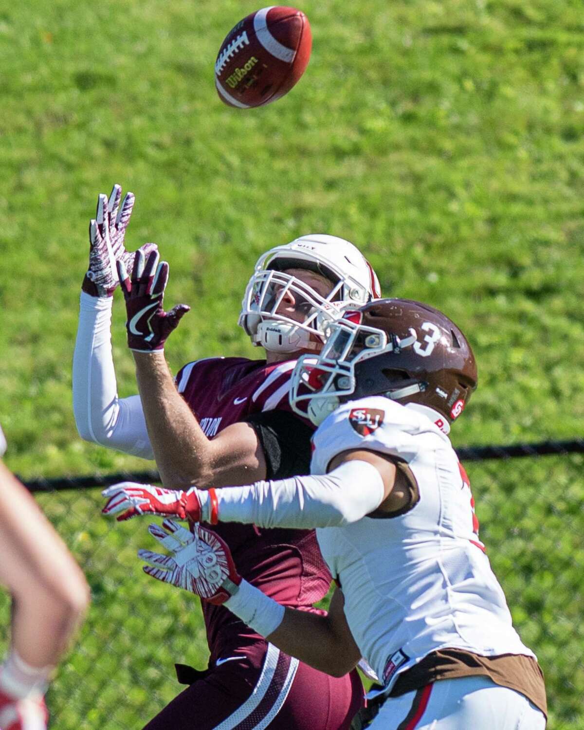 Union College receiver Will Sirmon makes a catch in front of St. Lawrence defensive back Rahmod Johnson during a game at Union College on Saturday, Oct. 19, 2019 (Jim Franco/Special to the Times Union.)