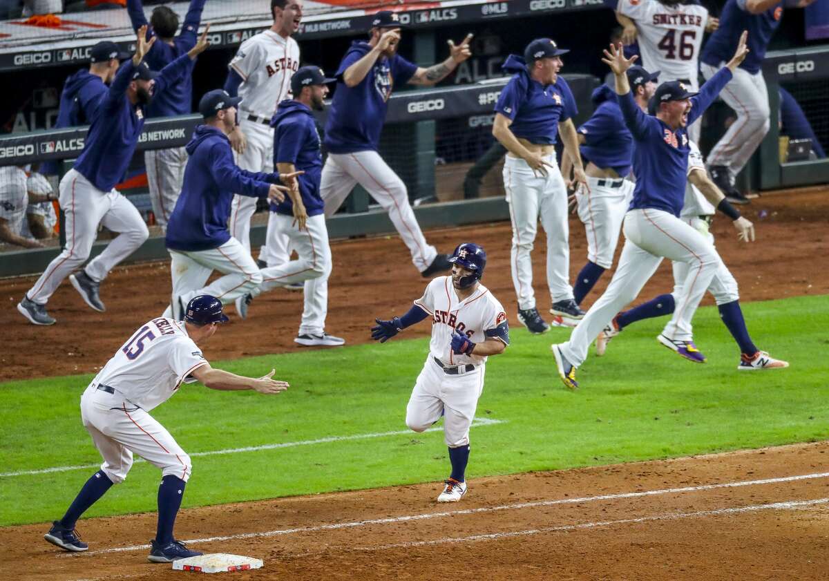 Houston Astros second baseman Jose Altuve (27) rounds first after hitting a game-winning, two-run, walk-off home run to win Game 6 of the American League Championship Series in the ninth inning at Minute Maid Park in Houston on Saturday, Oct. 19, 2019.