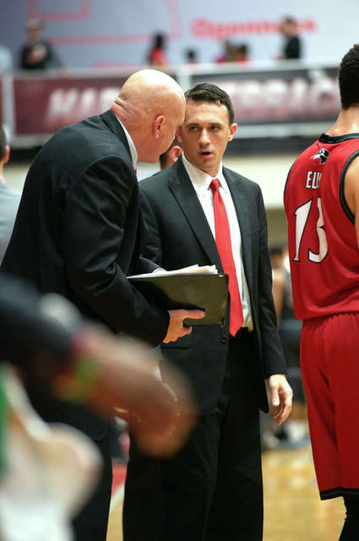 First-year SIUE basketball coach Brian Barone, right, is shown last season last season on the sideline with then-fellow assistant coach Mike Waldo. SIUE finished at No. 11 in a preseason Ohio Valley Conference media poll.