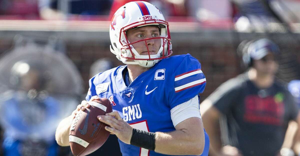 SMU quarterback Shane Buechele (7) prepares to throw the ball during the second quarter of an NCAA college football game against Temple in Dallas, Saturday, Oct. 19, 2019. (AP Photo/Sam Hodde)