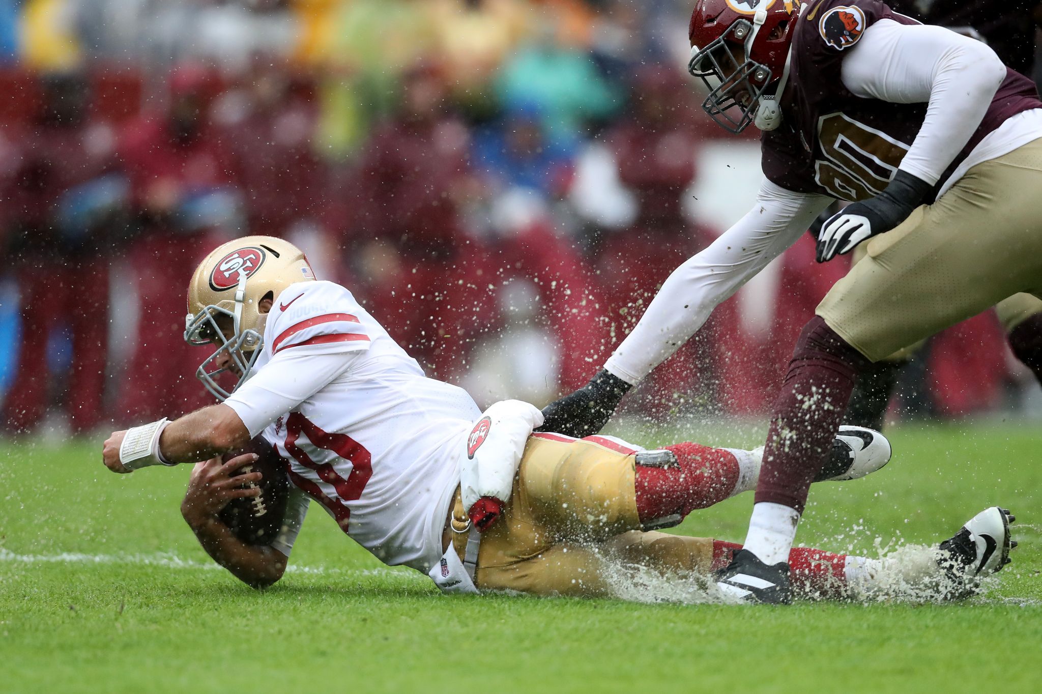 Drenching rain turns 49ers game into giant slip-n-slide