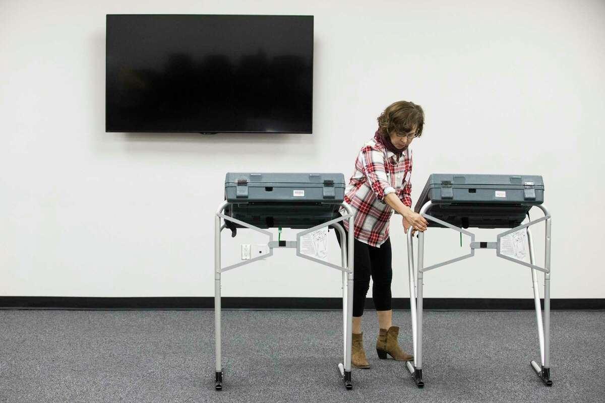 Harris County County Attorney Conference Center early voting election clerk Ana Coello setting up the voting machines on Friday, Oct. 18, 2019, in Houston. Early voting begins Monday ahead of the Nov. 5 election, when Houston and Harris County voters will cast ballots for mayor, city council, controller and a host of referendums and other offices.
