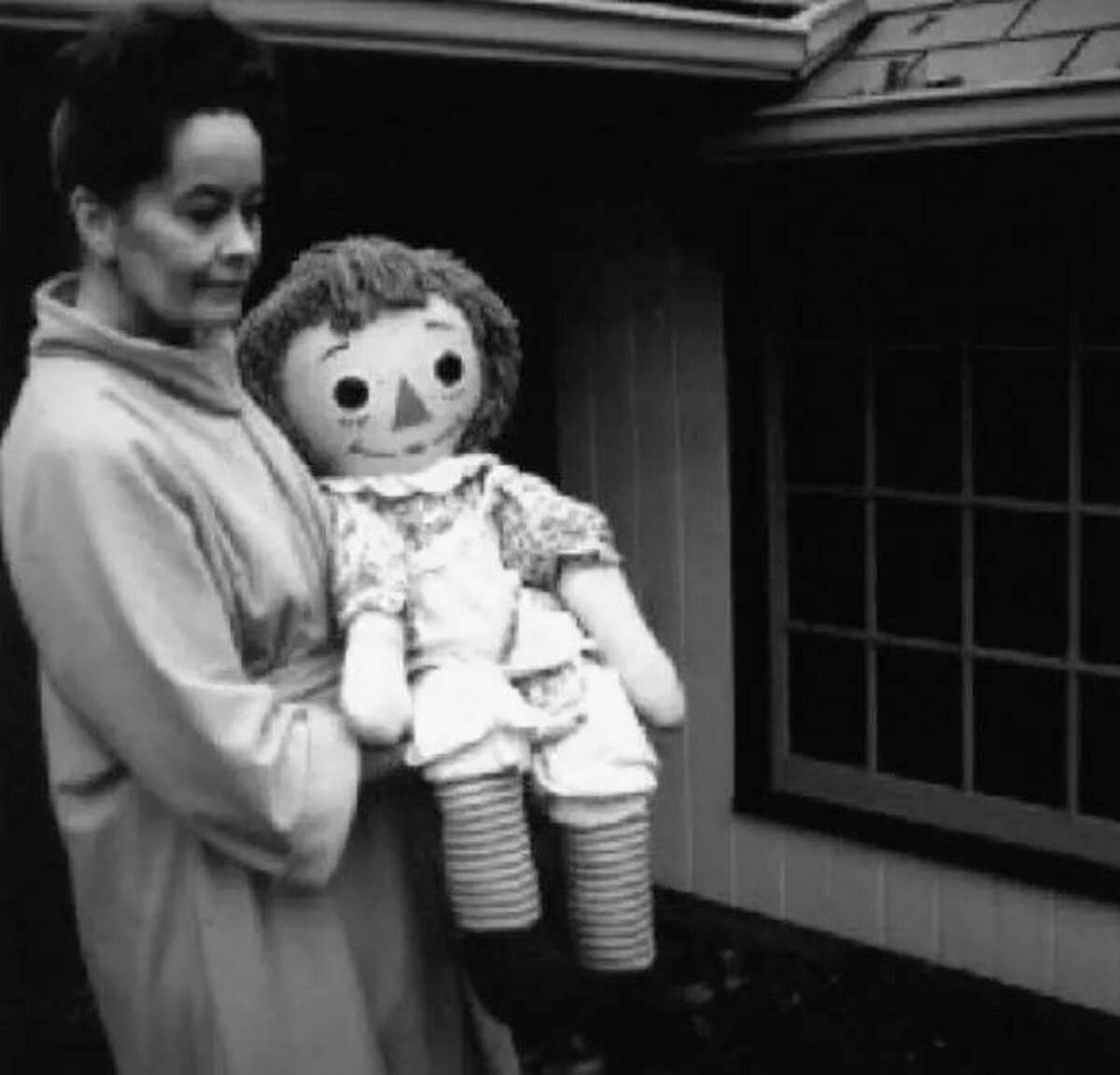 Lorraine Warren holds Annabelle, the Raggedy Ann doll displayed at the Warren’s Occult Museum, in Monroe, Conn.