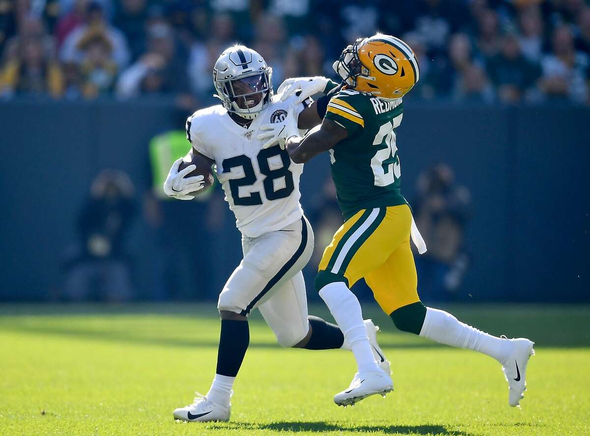 Josh Jacobs Oakland Raiders Unsigned 16 x 20 Touchdown Dive Spotlight  Photograph