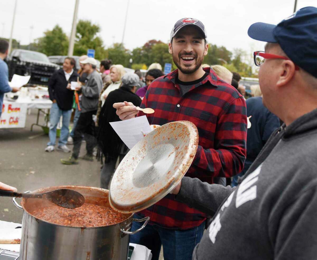 Stamford resident Greg Johnson tries a sample of Not 'Joe' Mamma's Chili at the 12th Annual Charity Chili Cookoff at J. M. Wright Technical High School in Stamford, Conn. Sunday, Oct. 20, 2019. The event featured more than a dozen local contestants offering many unique and flavorful varieties of chili to benefit the Food Bank of Lower Fairfield County.