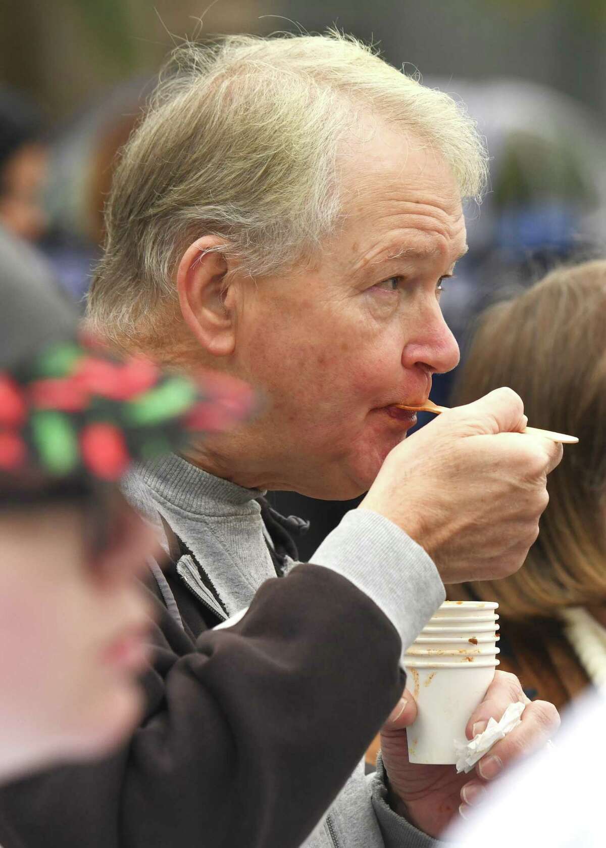Stamford's Ken McCue racks up a number of sample cups as her tries another chili at the 12th Annual Charity Chili Cookoff at J. M. Wright Technical High School in Stamford, Conn. Sunday, Oct. 20, 2019. The event featured more than a dozen local contestants offering many unique and flavorful varieties of chili to benefit the Food Bank of Lower Fairfield County.