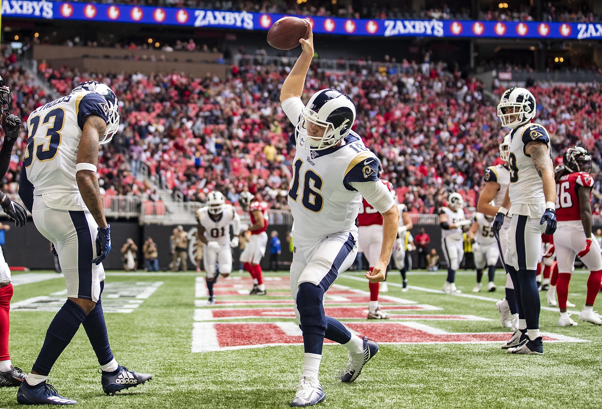 Jared Goff passes for two TDs, runs for one as Rams end slide