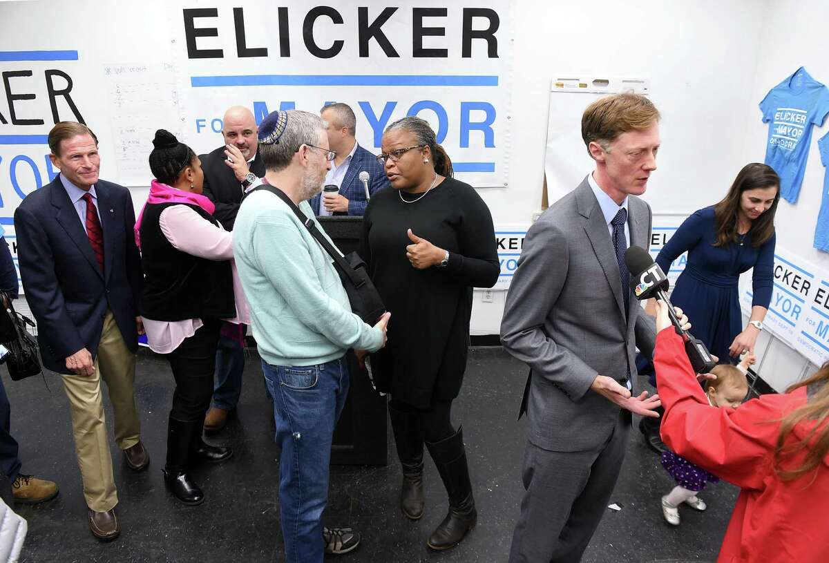 New Haven Democratic nominee for mayor Justin Elicker (right) is interviewed after a unity rally for Elicker at his campaign headquarters on Whalley Avenue in New Haven on October 20, 2019.