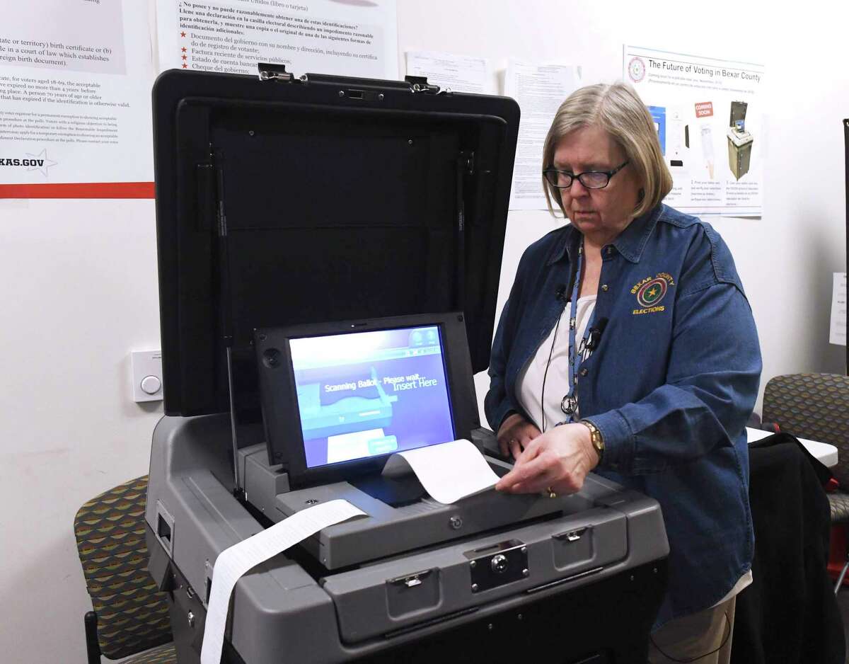 Bexar County Elections Administrator Jacque Callanen demonstrates a new voting machine.