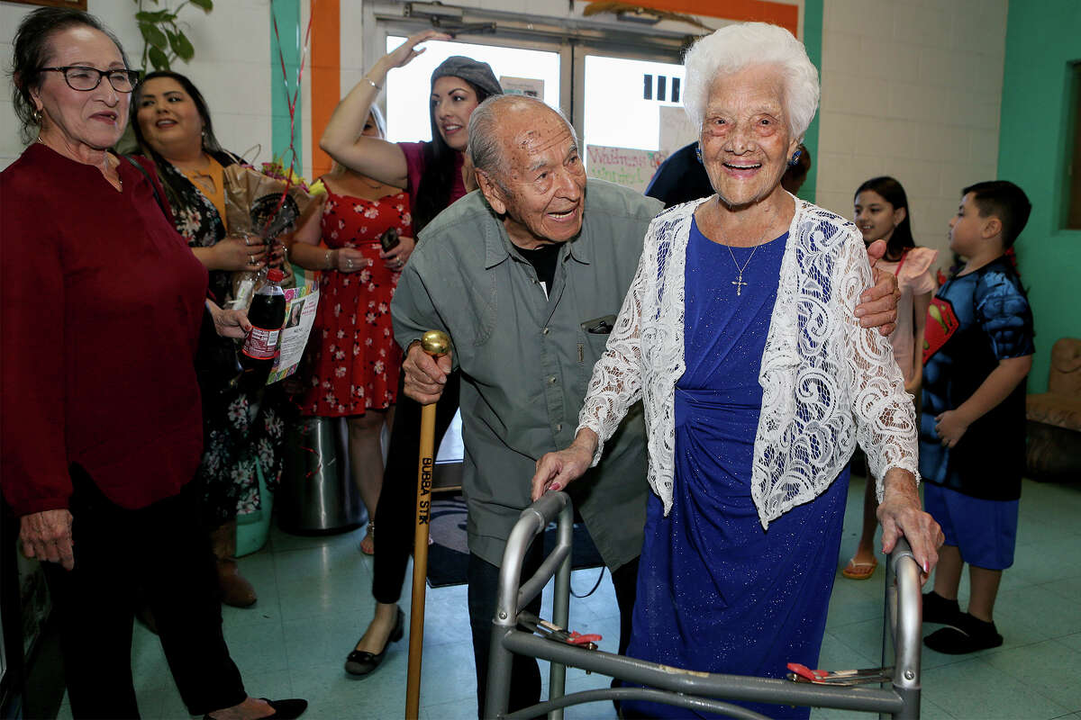Ofelia Gonzales is met by an old friend, Cristobal Licea, 96, as she arrives to celebrate her 109th birthday with friends and family at Arizona Cafe, 1111 S. General McMullen Dr., on Thursday, Oct. 10, 2019. Gonzales is one of approximately 80,000 centenarians living in the United States.