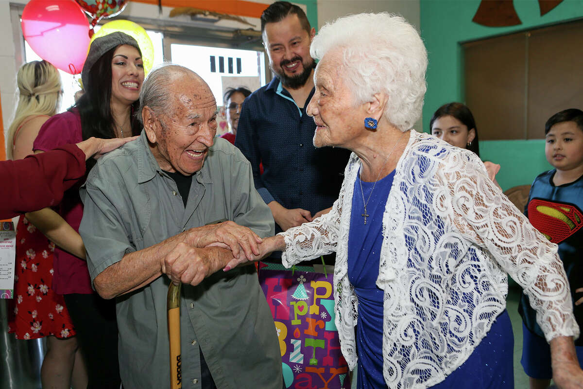 Ofelia Gonzales is met by an old friend, Cristobal Licea, 96, as she arrives to celebrate her109th birthday with friends and family at Arizona Cafe, 1111 S. General McMullen Dr., on Thursday, Oct. 10, 2019. Gonzales is one of approximately 80,000 centenarians living in the United States.