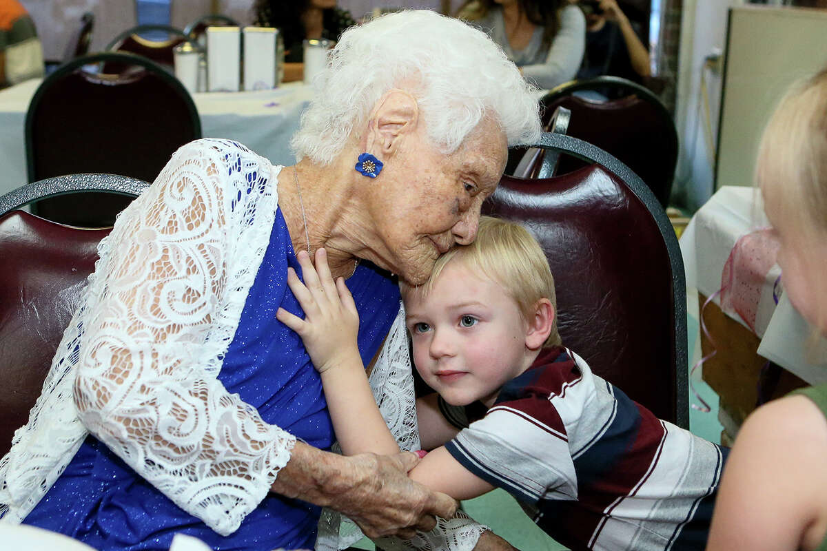Ofelia Gonzales receives a hug from her 3-year-old great-great grandson Oakley Hancock while celebrating her 109th birthday with friends and family at Arizona Cafe, 1111 S. General McMullen Dr., on Thursday, Oct. 10, 2019. Gonzales is one of approximately 80,000 centenarians living in the United States.