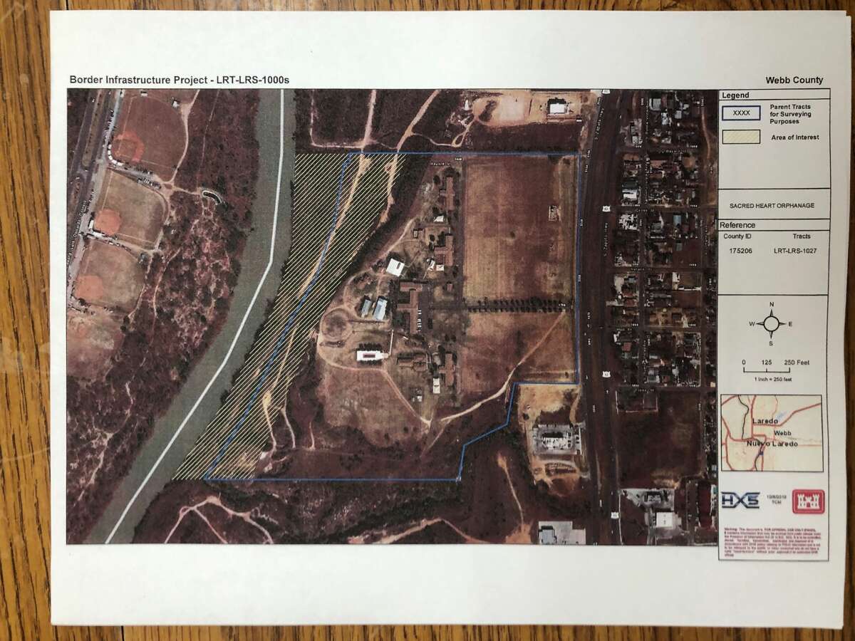 Three sisters from Sacred Heart Children’s Home attended a meeting on Thursday with Border Patrol and other south Laredo landowners. Shown is an aerial map of their riverfront property, the floodplain shaded in yellow. The feds will be testing the soil in this area to see if they can build a fence through it, said Sister Maria Teresa.