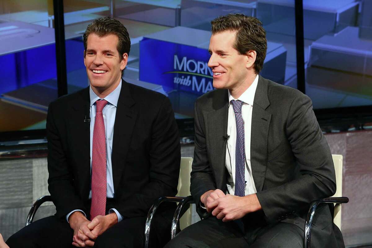 NEW YORK, NY - DECEMBER 11: (L-R) Entrepreneurs Tyler Winklevoss and Cameron Winklevoss discuss bitcoin with with Maria Bartiromo during FOX Business' "Wall Street Week" at FOX Studios on December 11, 2017 in New York City. (Photo by Astrid Stawiarz/Getty Images)