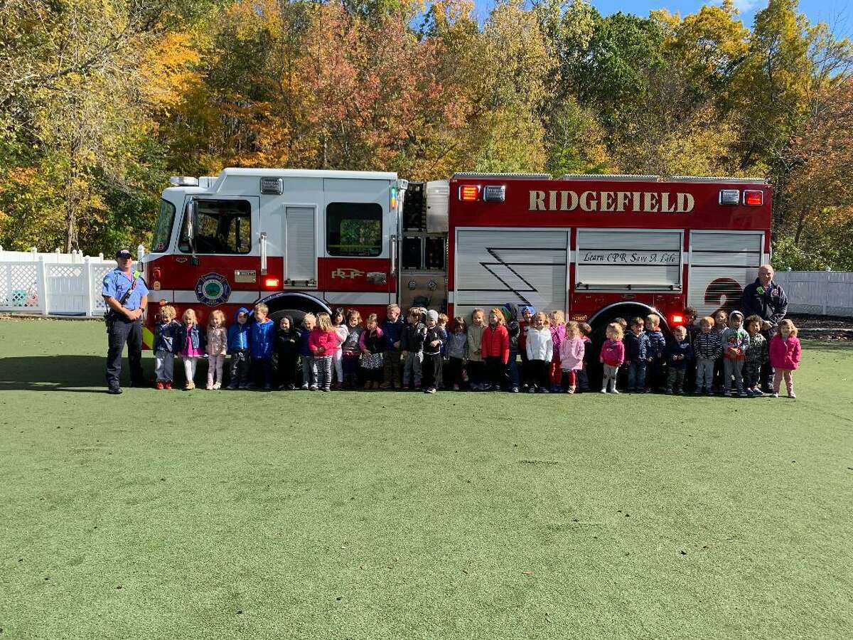 On Friday October 18, two Ridgefield Fire Department firefighters came out to speak to the children about fire safety and the importance of dialing 911 in an emergency. The firefighters also showed the children how they put on their gear and demonstrated the equipment. "We would like to thank the Ridgefield Fire Department for coming to Children's Academy," said Peggy Define.