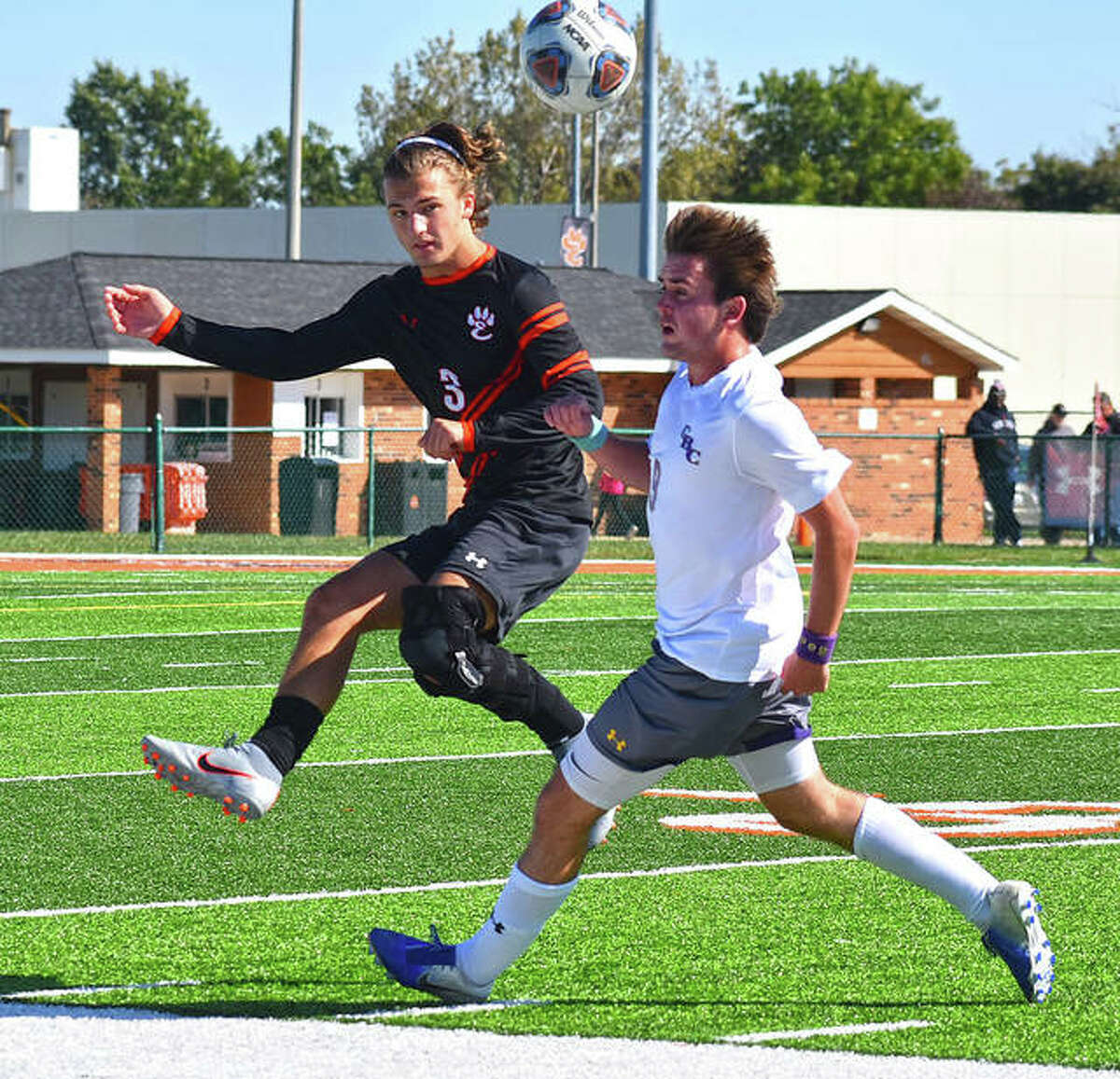 Edwardsville defender Kadin Lieberman, left, clears the ball away from a CBC player in the first half of the regular-season finale on Oct. 12 inside the District 7 Sports Complex.