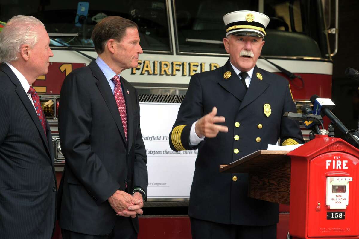 Fire Chief Denis McCarthy speaks during a press conference in front of the Fairfield Fire Department headquarters in Fairfield, Conn. Oct. 18, 2019. McCarthy was joined by First Selectman Mike Tetreau, left, and U.S. Senator Richard Blumenthal to announce a FEMA grant the Fairfield Fire Department recently received.