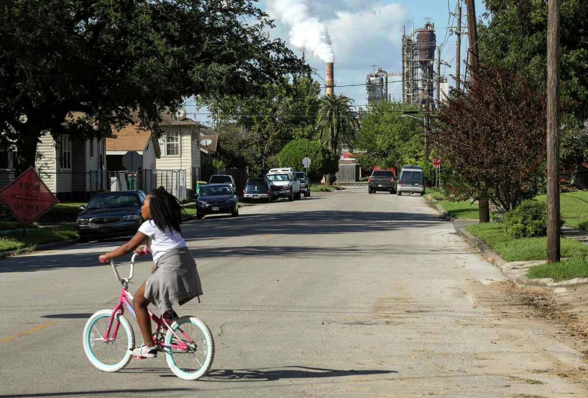 Rhianna Winslow, 9, rides her bike in front of her house on Oklahoma Street on Tuesday, Sept. 24, 2019, in Baytown. Winslow said "it stank" the previous week. Overall, industrial businesses released about 81,000 pounds of pollutants, according to final reports submitted to the Texas Commission on Environmental Quality — down from early estimates of nearly 95,000 pounds. Much of that was concentrated in Harris, Jefferson and Brazoria counties.