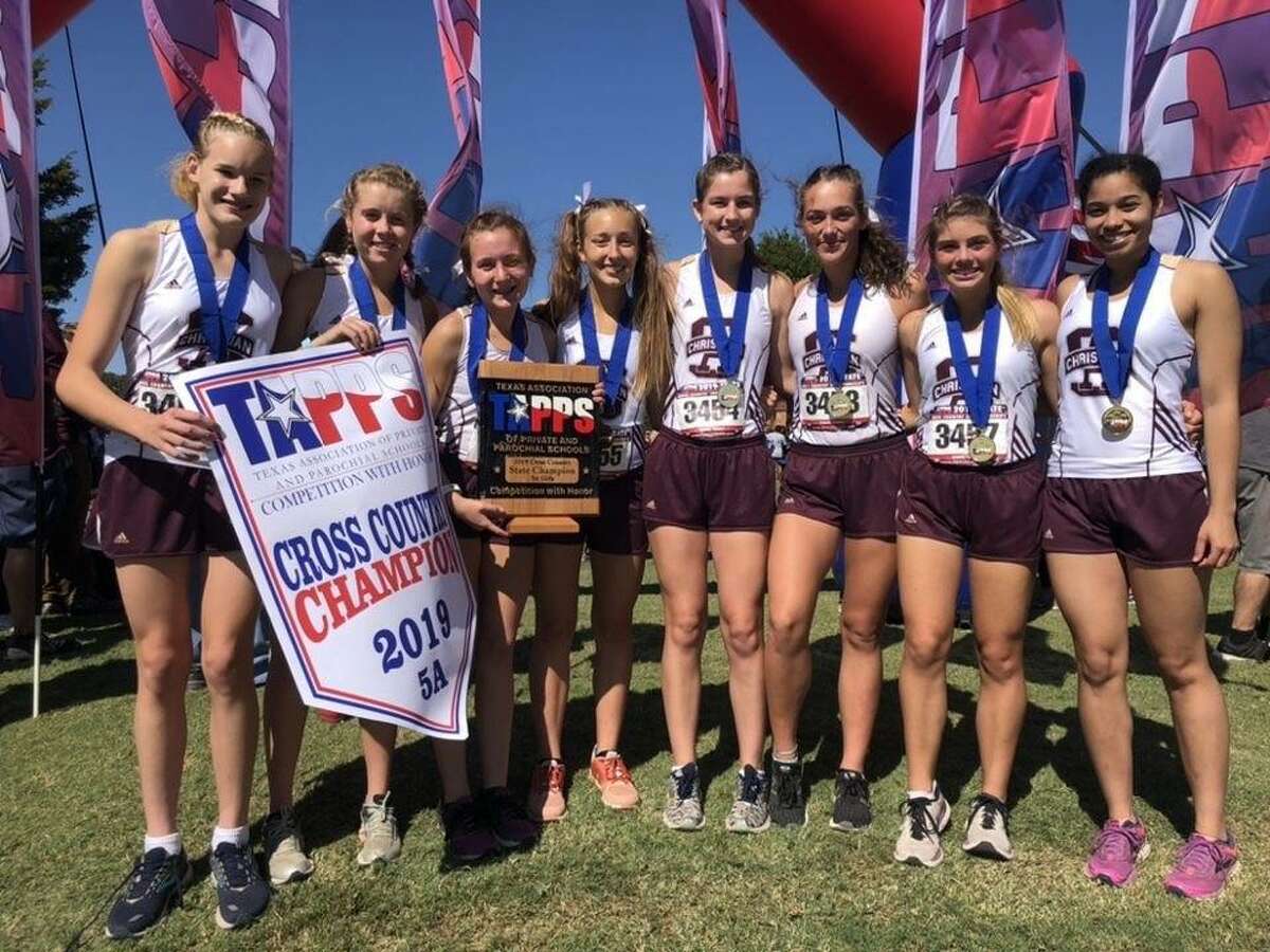 The S.A. Christian girls cross country team celebrates its first Class 5A TAPPS state title since 2009 at Cottonwood Creek Golf Course.