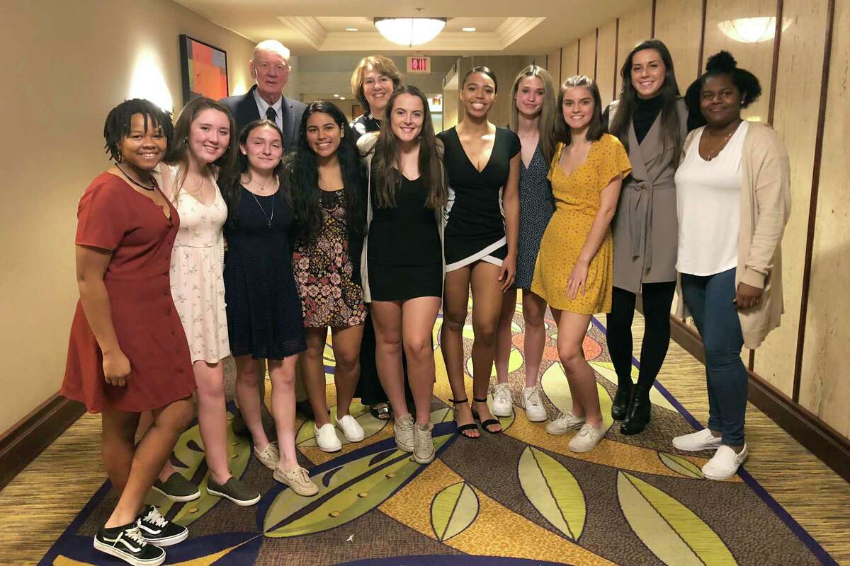 The Trinity Catholic Crusaders girls basketball players pose for a picture at the Fairfield County Sports Commission’s annual Sports Night awards dinner at the Stamford Marriott on Monday. The Crusaders were honored as Stamford’s Sports Persons of the Year for winning the CIAC Class S championship.