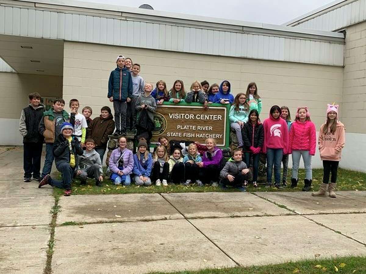 Students from Bonnie Brown's fifth grade classroom at Onekama Consolidated Schools pose in front of the Platte River State Hatchery. The students are taking part in the Salmon in the Classroom project this year. (Courtesy photo)