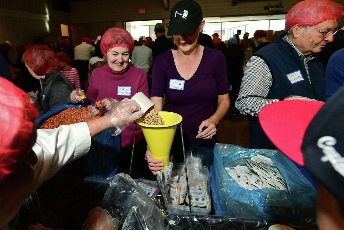 Hundreds of volunteers package meals for Wilton’s Wi-ACT Interfaith Committee the 6th annual Rise Against Hunger meal packaging event Saturday, October 19, 2019, at Wilton Presbyterian Church in Wilton, Conn. Four shifts of nearly 750 volunteers will load a shipping container destined for Somalia with the completed meals.