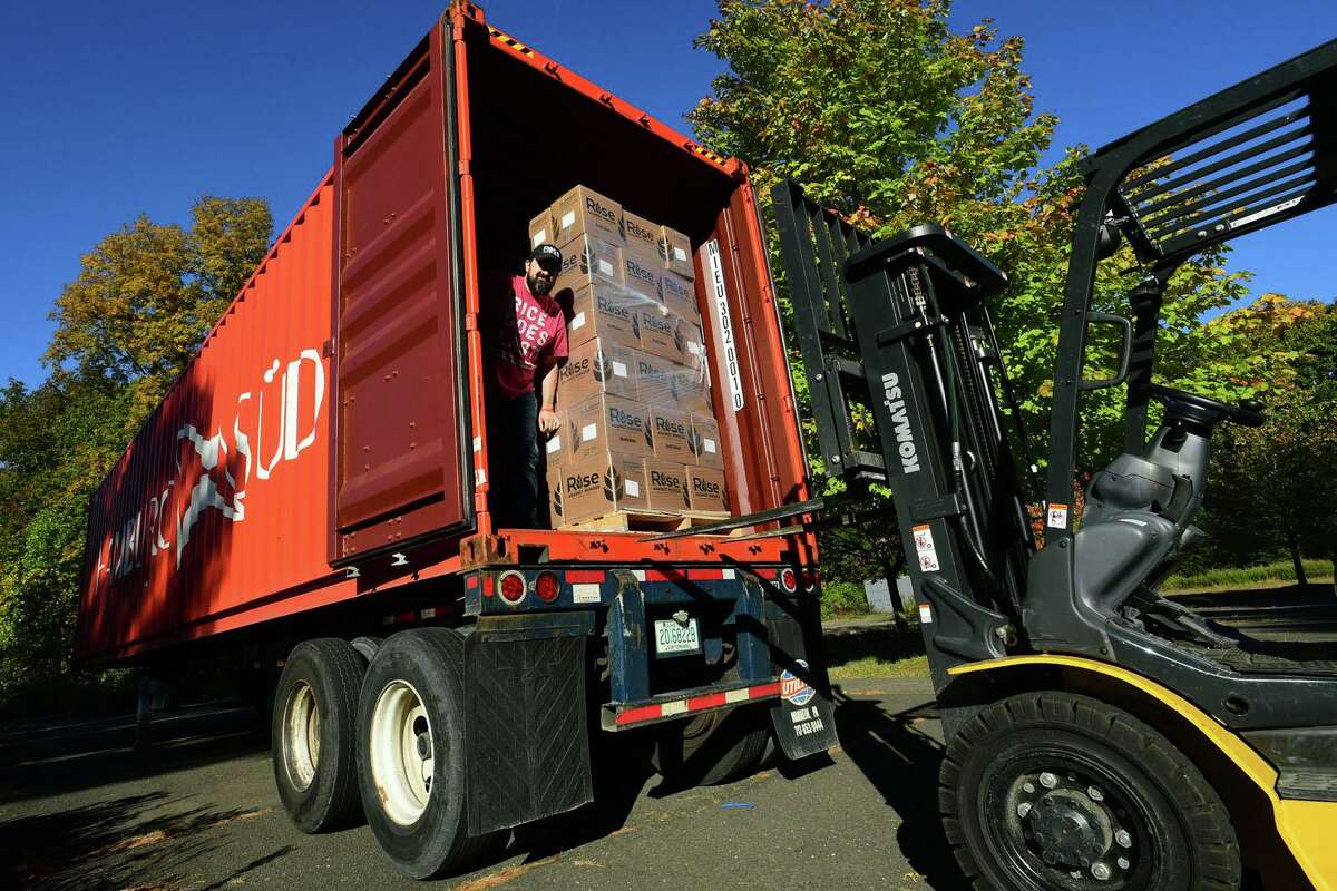Rise Against Hunger Community Engagement Coordinator David Barletta helps hundreds of volunteers package and load meals for Wilton’s Wi-ACT Interfaith Committee the 6th annual Rise Against Hunger meal packaging event Saturday, October 19, 2019, at Wilton Presbyterian Church in Wilton, Conn. Four shifts of nearly 750 volunteers will load a shipping container destined for Somalia with the completed meals.
