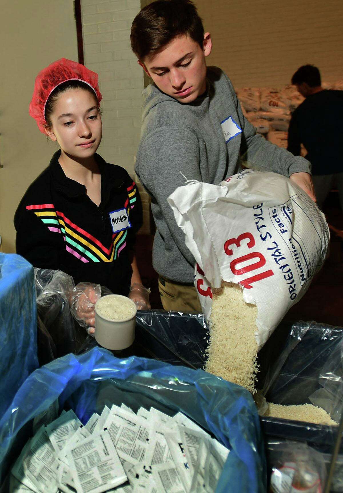 Hundreds of volunteers package meals for Wilton’s Wi-ACT Interfaith Committee the 6th annual Rise Against Hunger meal packaging event Saturday, October 19, 2019, at Wilton Presbyterian Church in Wilton, Conn. Four shifts of nearly 750 volunteers will load a shipping container destined for Somalia with the completed meals.