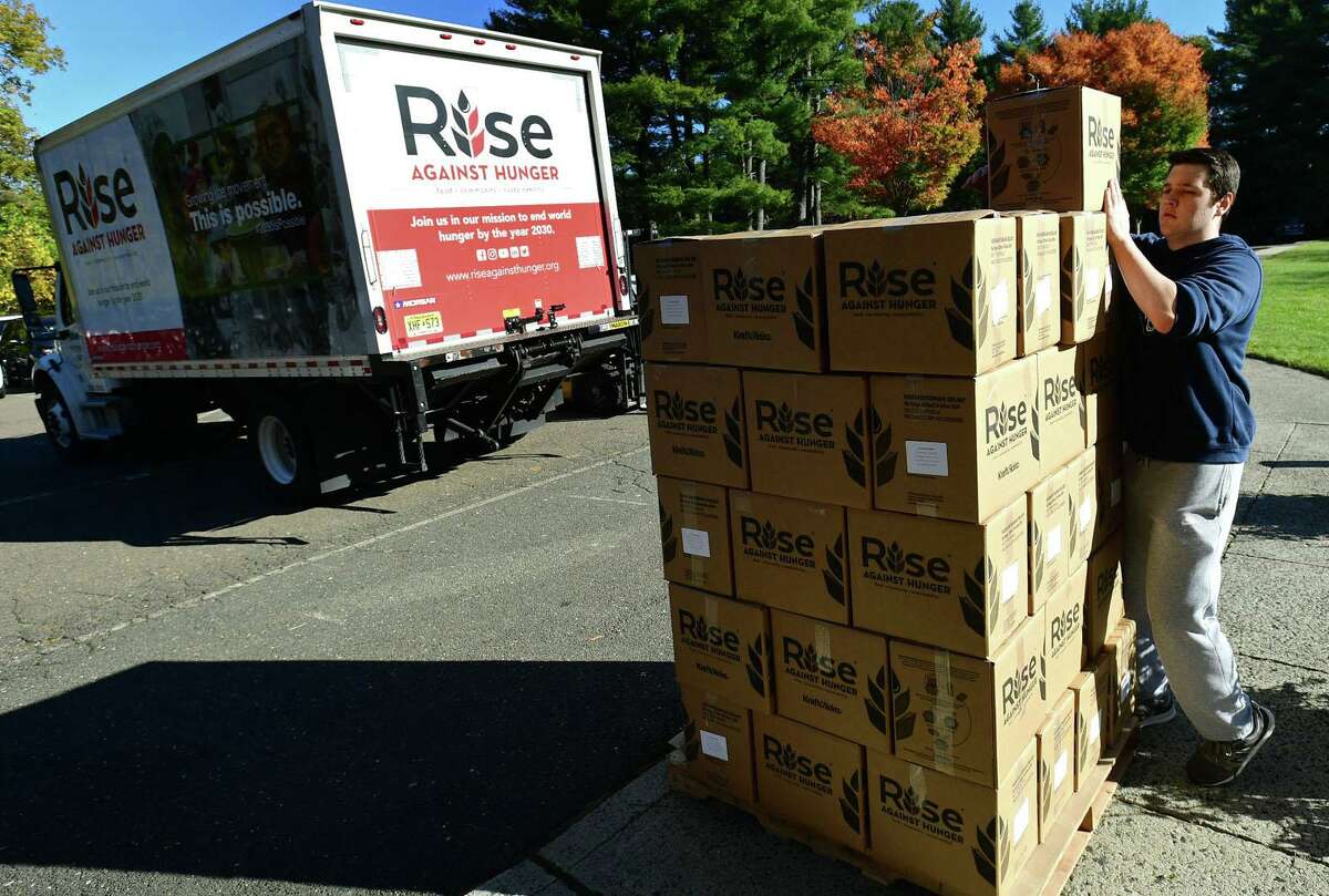 Hundreds of volunteers package meals for Wilton’s Wi-ACT Interfaith Committee the 6th annual Rise Against Hunger meal packaging event Saturday, October 19, 2019, at Wilton Presbyterian Church in Wilton, Conn. Four shifts of nearly 750 volunteers will load a shipping container destined for Somalia with the completed meals.