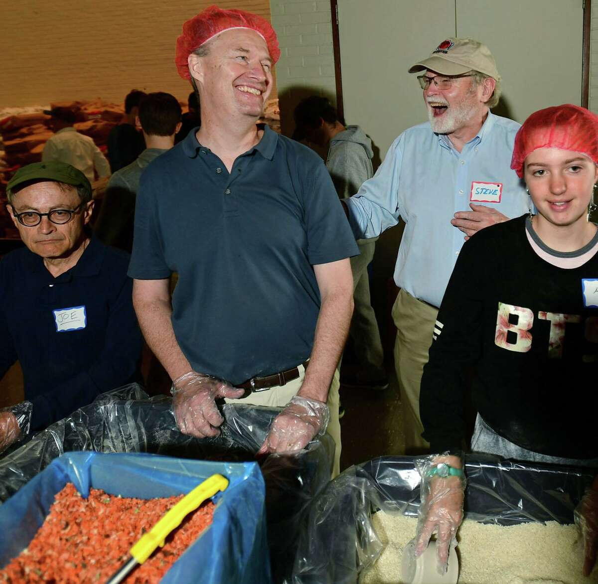 Hundreds of volunteers package meals for Wilton’s Wi-ACT Interfaith Committee the 6th annual Rise Against Hunger meal packaging event Saturday, October 19, 2019, at Wilton Presbyterian Church in Wilton, Conn. Four shifts of nearly 750 volunteers will load a shipping container destined for Somalia with the completed meals.