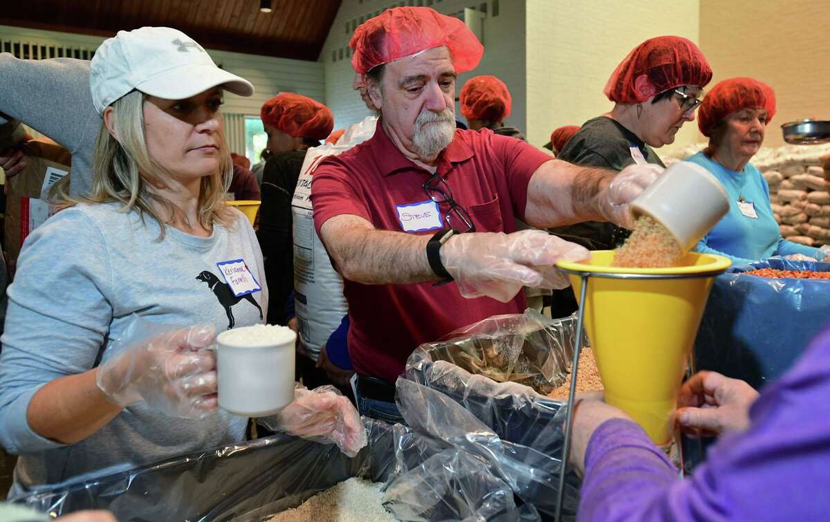 Hundreds of volunteers package meals for Wilton’s Wi-ACT Interfaith Committee the 6th annual Rise Against Hunger meal packaging event Saturday, October 19, 2019, at Wilton Presbyterian Church in Wilton, Conn. Four shifts of nearly 750 volunteers will load a shipping container destined for Somalia with the completed meals.