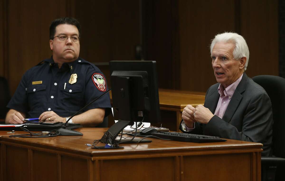 Contra Costa County Fire Chief Lewis Broschard (left) and Randy Sawyer, director of the county's Hazardous Materials Program, appear for a discussion about the NuStar fuel storage tank explosion and fire at a Board of Supervisors meeting in Martinez, Calif. on Tuesday, Oct. 22, 2019.