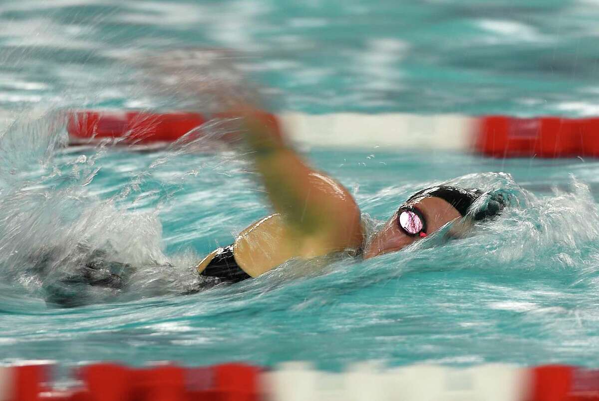 Ridgefield's Rylie Giles swims her way to a first-place finish in the 500 meter freestyle race at the high school girls swimming FCIAC championship at Greenwich High School in Greenwich, Conn. Thursday, Nov. 1, 2018.