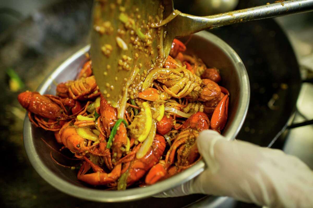 Crawfish are tossed in the Kitchen Special sauce at Cajun Kitchen.