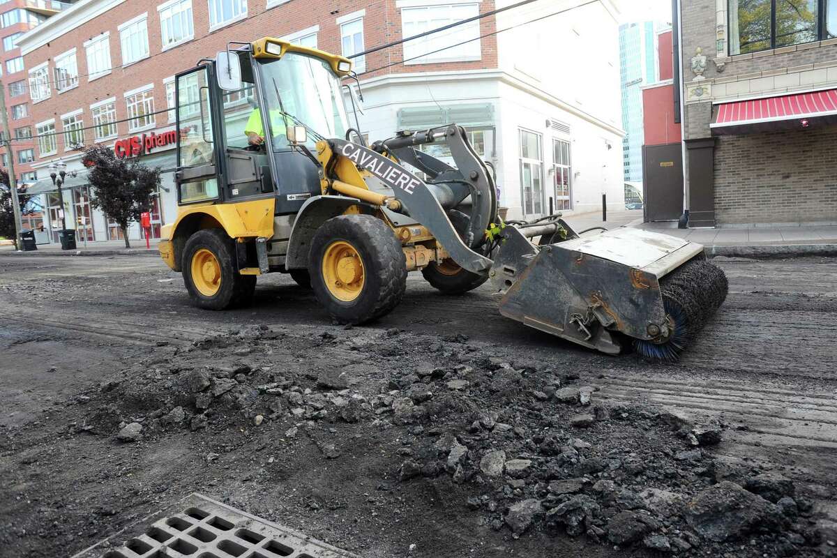 A construction crew paves Forest Street in downtown Stamford, Conn. on Monday, Oct. 23, 2017.