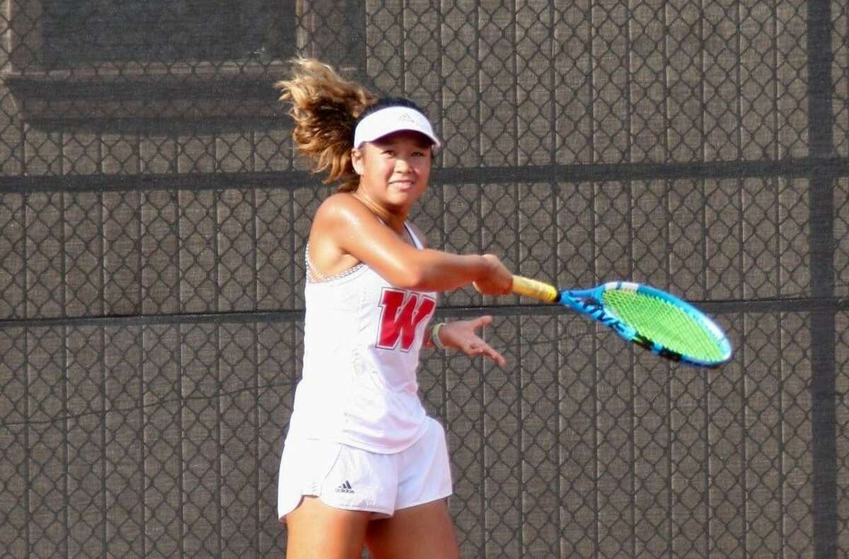 Rachel Sam competes in a tennis match for The Woodlands during the 2019 fall season.