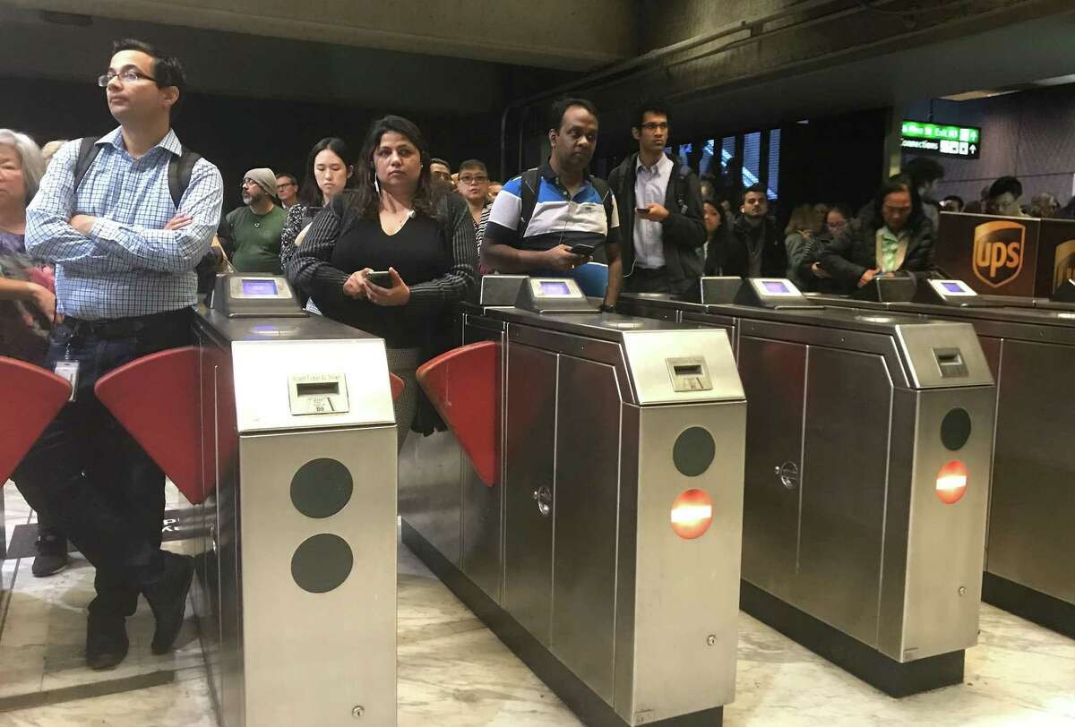 BART service has stopped in the Transbay Tube due to an equipment problem on the track on Tuesday, October 22, 2019. Passengers wait to re-enter the Embarcadero Street Station.