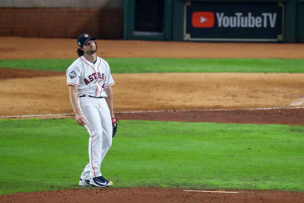 Houston Astros starting pitcher Gerrit Cole (45) reacts after allowing a two-run double by Washington Nationals left fielder Juan Soto (22) during the fifth inning of Game 1 of the World Series at Minute Maid Park in Houston on Tuesday, Oct. 22, 2019.