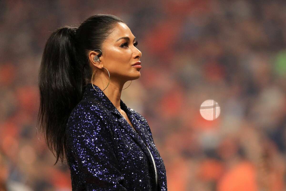 HOUSTON, TEXAS - OCTOBER 22: American singer-songwriter Nicole Scherzinger performs the national anthem prior to Game One of the 2019 World Series between the Houston Astros and the Washington Nationals at Minute Maid Park on October 22, 2019 in Houston, Texas. (Photo by Mike Ehrmann/Getty Images)