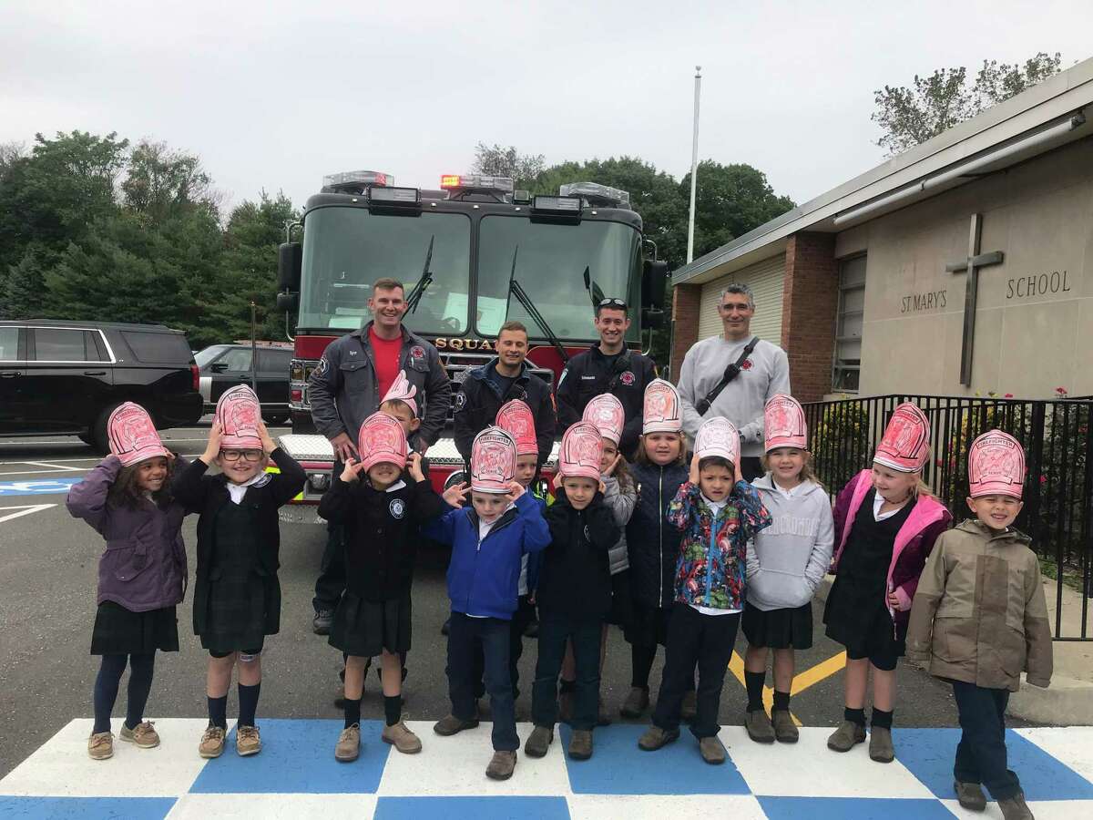 For Fire Safety Month, Milford firefighters visited St. Mary School to talk to preschool and kindergarten students about gear and all the parts of the big trucks.