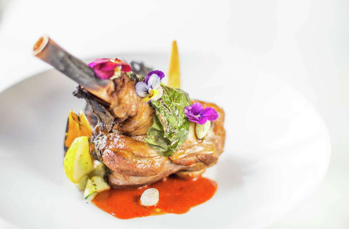 Chamorro de Borrego (lamb shank wrapped in hoja santa, mole de olla, spring vegetables) at Xochi.
