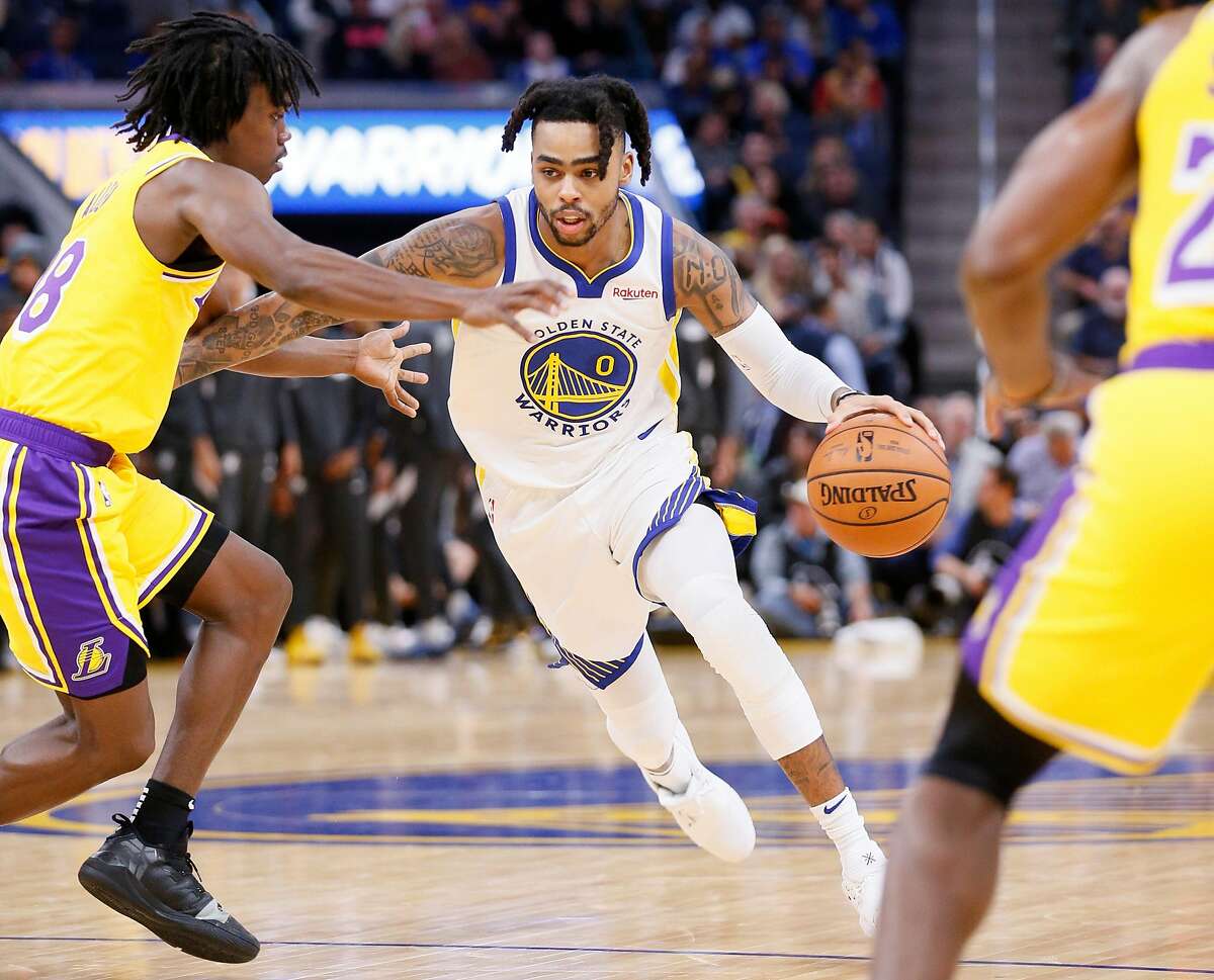Golden State Warriors guard D'Angelo Russell (0) dribbles against Los Angeles Lakers Marcus Allen (28) during an NBA preseason game at Chase Center on Friday, Oct. 18, 2019, in San Francisco, Calif.