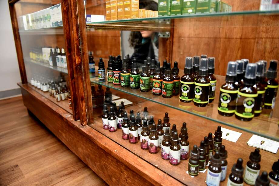 CBD oils are displayed at Upstate CBD on Upper Union Street store on Tuesday, June 4, 2019, in Schenectady, N.Y. The shop offers CBD hemp buds, edibles, extractions, topicals and pet products. Store owner Donald Andrews hopes the business will give him a foothold should New York legalize recreational marijuana. (Will Waldron/Times Union) Photo: (Will Waldron/Times Union)