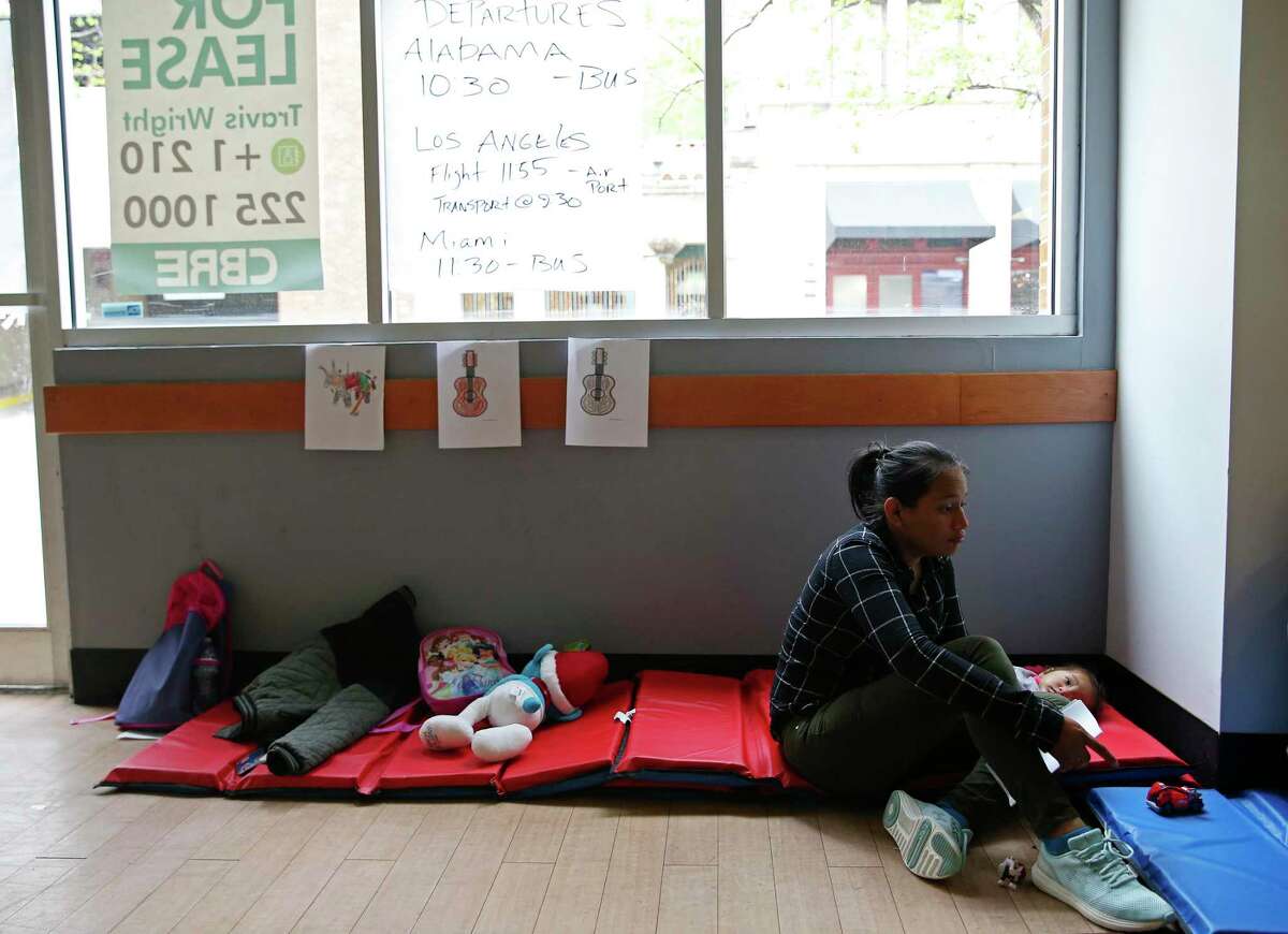 An immigrant sits with her child at the City of San Antonio Resource Center, Monday, April 1, 2019. The immigrant said she left Honduras 11 days ago and spent 24 hours in Department of Homeland Security custody after crossing the Rio Grande in Eagle Pass, Texas. The center is located on city-owned property across the street from the Greyhound Bus depot. It opened Saturday evening in response to an increase of immigrants dropped off at the depot by Department of Homeland Security. According to Assistant City Manager Colleen Bridger, the center has processed between 75-100 immigrants daily and is opened from 6 a.m. to 10 p.m.