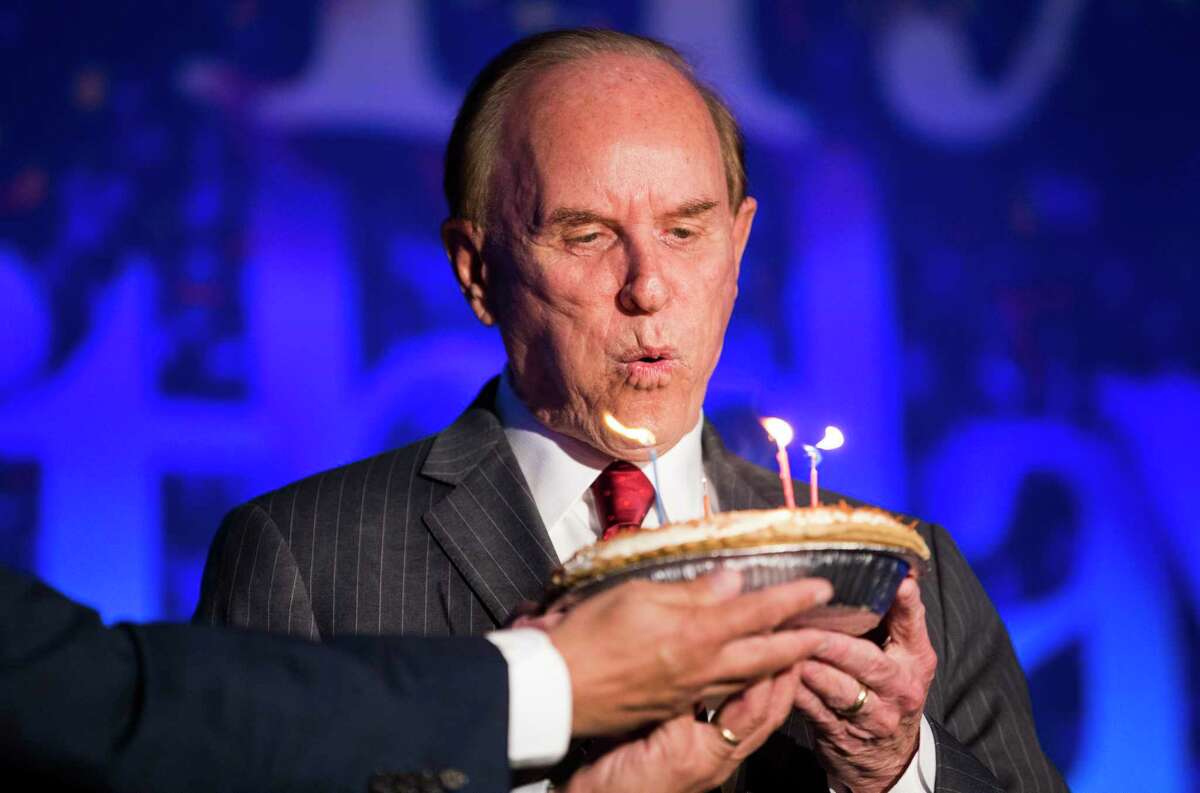 Bexar County Judge Nelson Wolff attempts to blowout birthday candles after he delivered the annual State of the County Address during a San Antonio Chamber of Commerce luncheon at the Henry B. Gonz‡lez Convention Center in San Antonio on Wednesday, Oct. 23, 2019. Wolff later laughed after the candles would reignite after he blew them out.