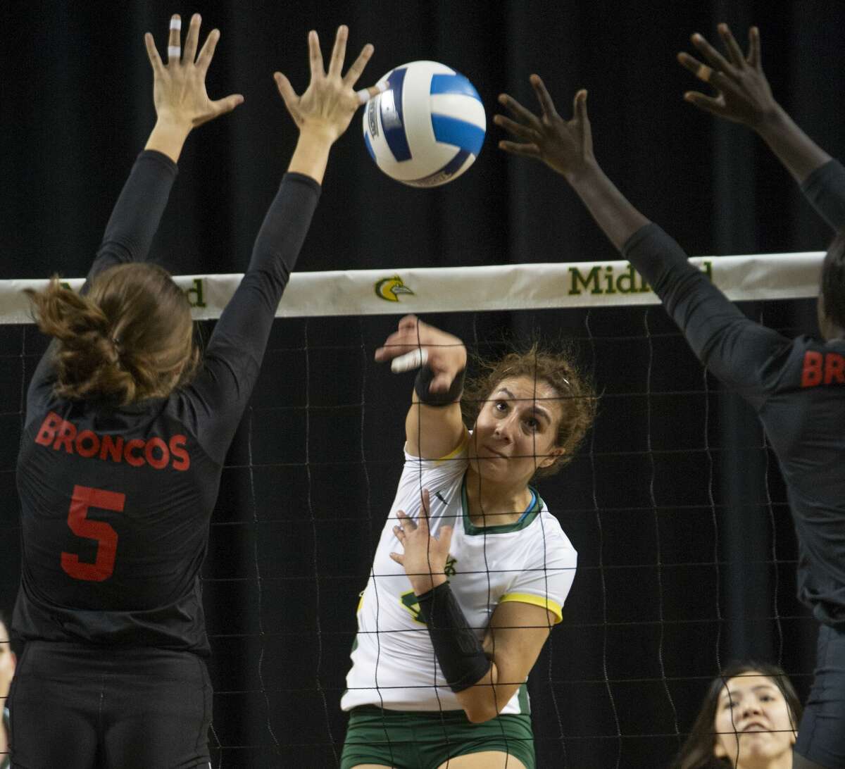 Midland College's Lina Espejo Ramirez hits the ball between New Mexico Military Institute's Vittoria Price and Nyauner Bidit 10/23/19 at the Chaparral Center. Tim Fischer/Reporter-Telegram