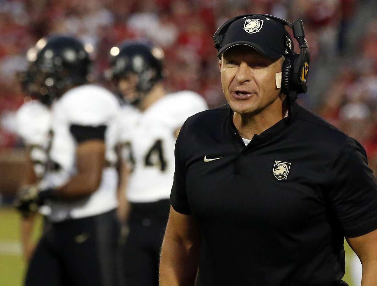 FILE- In this Sept. 22, 2018, file photo, Army head coach Jeff Monken shouts in the first half of an NCAA college football game against Oklahoma in Norman, Okla. For all the complaints about too many bowls, this is the second straight season there will be more bowl eligible teams (at least 81) than available bids (78). That has put No. 23 Army and fellow football independent BYU (6-6), another school with a large national following, in the strange position of tracking results from all over the country in recent weeks and heading into college football's selection Sunday with postseason plans more uncertain than most. (AP Photo/Sue Ogrocki, File)