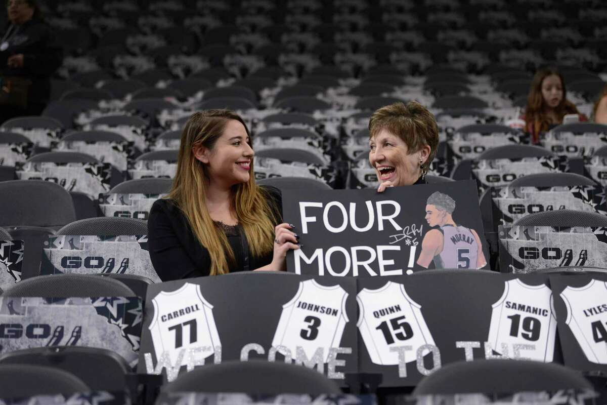 Analicia Veatch, left, and Jane Craig prepare several signs for the home opener as the San Antonio Spurs play the New York Knicks at the AT&T Center on Wednesday, Oct. 23, 2019.
