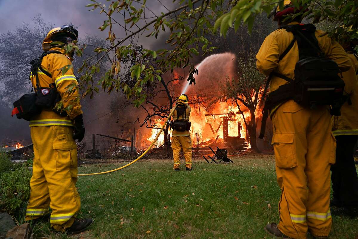 Firefighters contain a fire to a hours on Geyser Road,,Thursday, Oct. 24, 2019, in Geyserville, Calif.